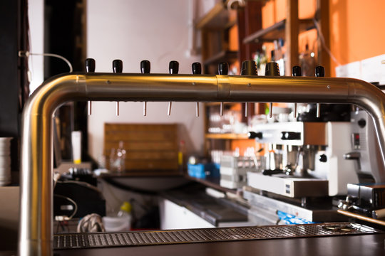 Image Of Modern Beer Bar With  Metal Beer Taps