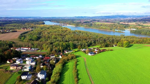 Aerial 4K view of river Danube with power plant in the distance