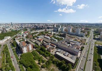 Summer city, road with cars and industrial zone, aerial view. Ekaterinburg, Verkh-Isetsky district, Russia