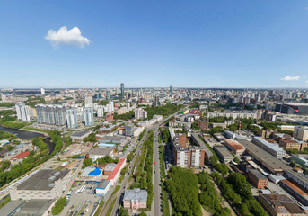 Summer city, road with cars and industrial zone, aerial view. Ekaterinburg, Verkh-Isetsky district, Russia