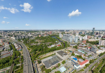Naklejka premium Summer city, road with cars and Iset river, a lot of trees, aerial view. Ekaterinburg, Verkh-Isetsky district, Russia