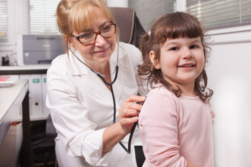 Pediatrician is visiting a child - 297287711