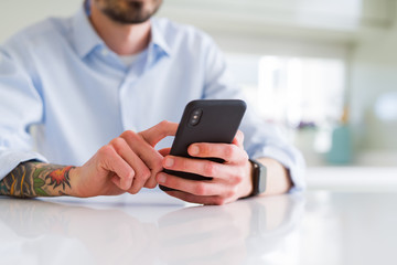 Close up of business man working using smartphone