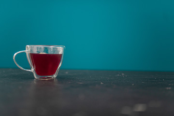 Cup of red tea on a marble desk