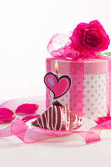cupcake with burning candle with gift box