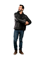 Naklejka premium Full-length shot of Biker man happy and smiling over isolated white background