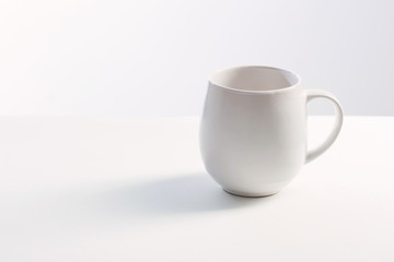 white cup on white white background