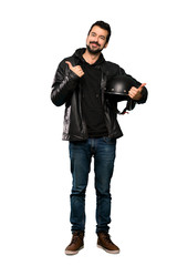 Fototapeta premium Full-length shot of Biker man with thumbs up gesture and smiling over isolated white background