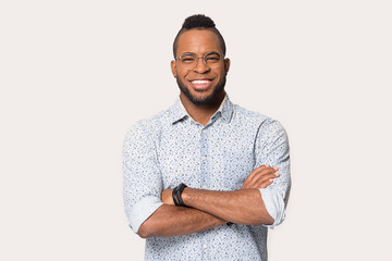 Smiling african American man in glasses posing in studio - Powered by Adobe