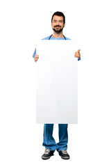 Surgeon doctor man holding an empty placard