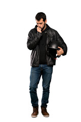 Fototapeta premium Full-length shot of Biker man having doubts over isolated white background