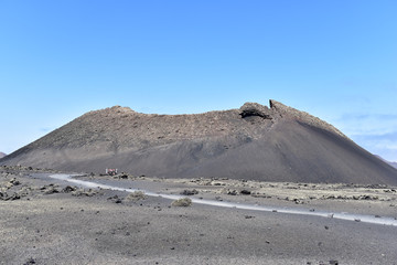 Red mountains and volcanic black land in Lanzarote Island, Canary Islands, Spain