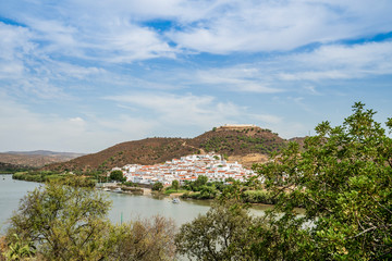 Fototapeta na wymiar Sanlucar de Guadiana in Spain pictured from portuguese side on the opposite side of Guadiana river