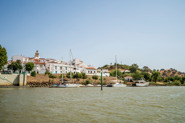 Naklejka premium Sanlucar de Guadiana pictured from Guadiana river