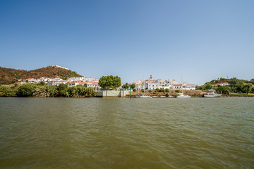 Fototapeta premium Sanlucar de Guadiana pictured from Guadiana river