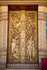 Carved wooden temple door Luang Prabang Laos