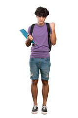 A full-length shot of a Young student man with angry gesture over isolated white background