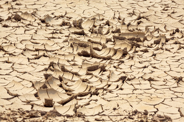 Top view of Dry land in the construction area. Cracked ground background
