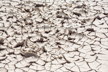 Top view of Dry land in the construction area. Cracked ground background