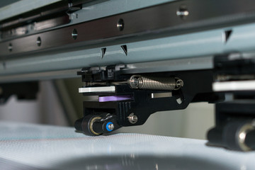 Fototapeta na wymiar Close detail of clamping piece of a vinyl printing plotter