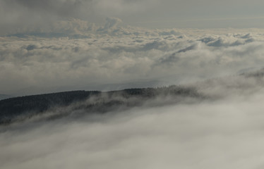 Fototapeta na wymiar Clouds in mountains, Krkonose