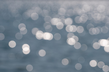 Gray and white bokeh from the lake surface