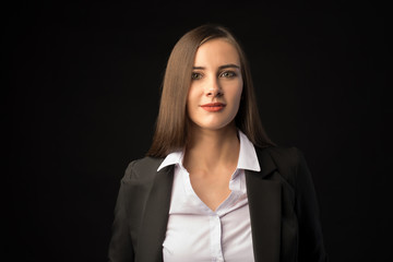 young beautiful brunette girl black background, portrait, straight long dark hair, black jacket, white blouse