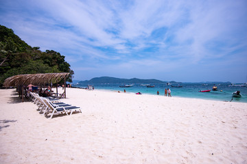 beach with chairs and umbrellas