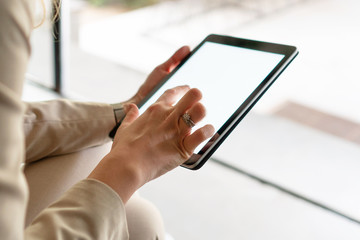 Females hands holding digital tablet	