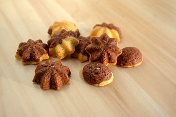 Cinnamon sandbakelse christmas cookies, two color, cocoa dark brown and vanilla light golden brown, delicious cookies