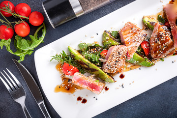 Grilled tuna with avocado. Healthy meal fusion style.