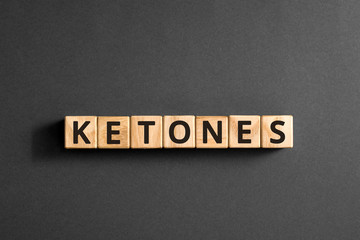 Ketones - word from wooden blocks with letters, chemical compound produced in the body urine burns...