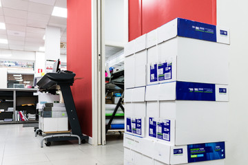 stacked paper package boxes stacked next to the store door