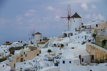 Fototapeta na wymiar windmills in santorini greece