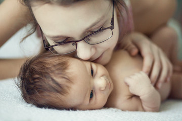 Young girl and newborn baby , close up