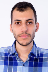 Obraz premium Face of young bearded Persian hipster man