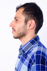 Closeup profile view of young bearded Persian hipster man