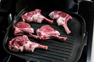 Raw Lamb Chops are Frying in Pan.