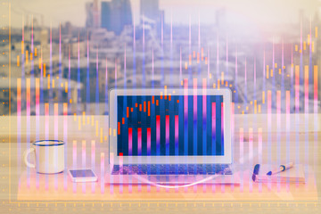 Financial graph colorful drawing and table with computer on background. Double exposure. Concept of...