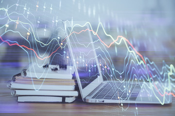 Stock market graph and table with computer background. Double exposure. Concept of financial analysis.