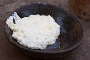Homemade butter in a dark bowl
