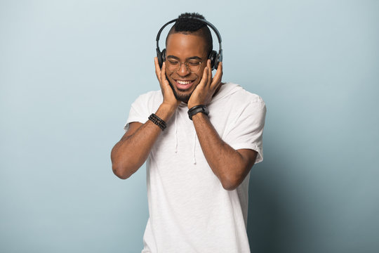 Smiling African American Man Listen To Music In Headphones