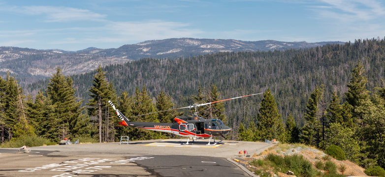 YOSEMITE NATIONAL PARK, USA - SEPTEMBER 13, 2019 : Resuce helicopter on the helipad at the Crane Flat fire lookout in Yosemite Park, California.