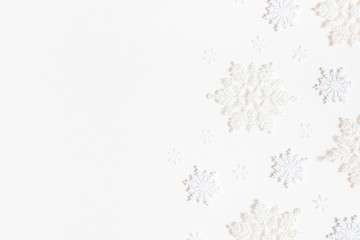 Christmas composition. Frame made of white snowflakes on white background. Christmas, winter, new...