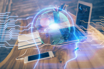 Double exposure of table with computer and brain hologram. Data innovation concept.