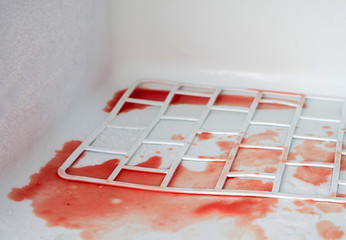 Bloodstained refrigerator. Problems storing fresh meat. Selective focus. - obrazy, fototapety, plakaty