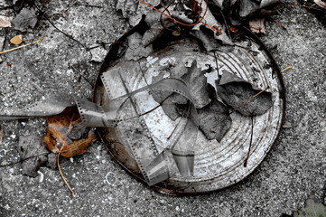 rusty box with old film strip in a background