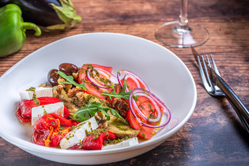 Grilled eggplant and roasted pepper salad with feta cheese.