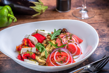 Grilled eggplant and roasted pepper salad with feta cheese.