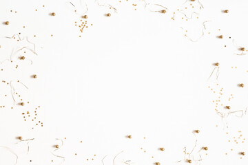 Christmas composition. Christmas golden confetti on white background. Flat lay, top view, copy space